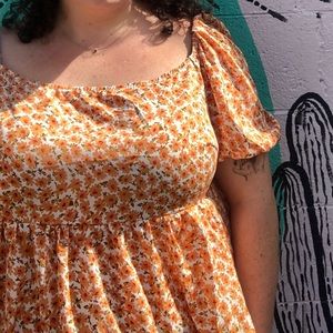 Orange floral peplum top